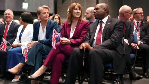 PA Media Britain's Foreign Secretary Yvette Cooper (L) Chancellor Rachel Reeves (C) and Deputy Prime Minister and Justice Secretary David Lammy (R), during the Labour Party Conference in Liverpool, Britain, 30 September 2025. The conference runs from 28 September to 01 October at the Arena Convention Centre in Liverpool.